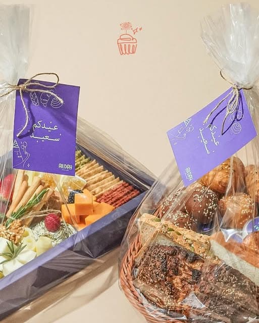 Gift hampers wrapped in cellophane with purple tags